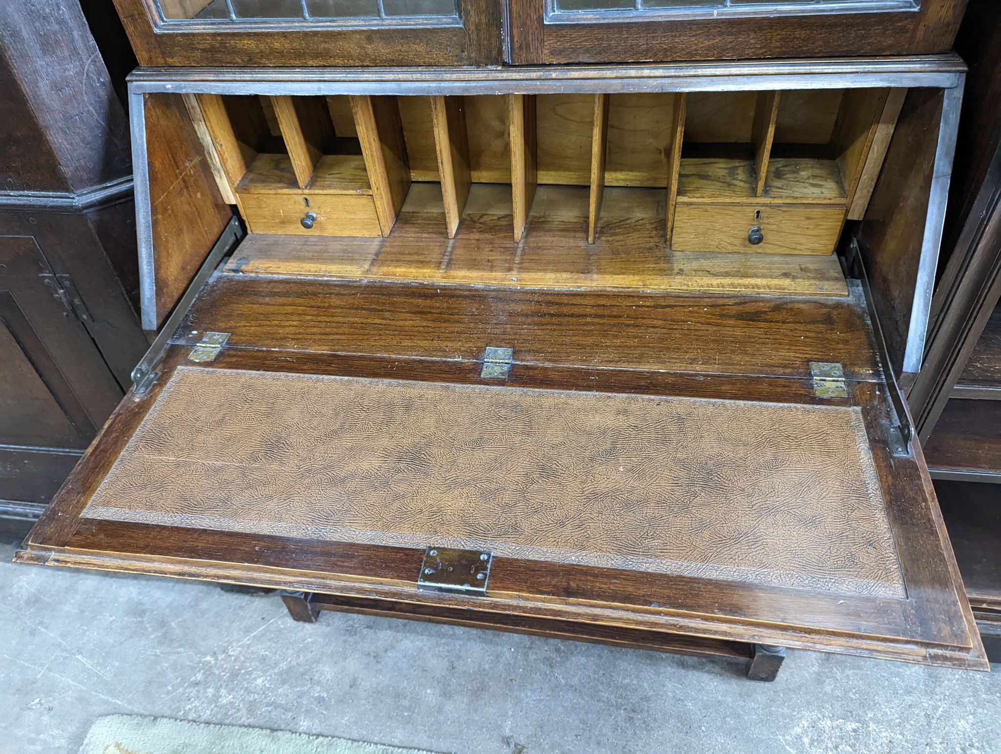 A 1920's oak glazed bureau bookcase, width 88cm, depth 42cm, height 200cm